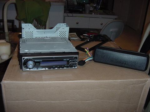 1989 BMW 3 Series - Car stereo and Kenwood speaker components are shown on a cardboard box, with wiring visible.