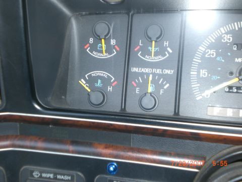 1991 Ford Bronco - Interior view of a vehicle's dashboard, displaying various gauges and a partial speedometer.