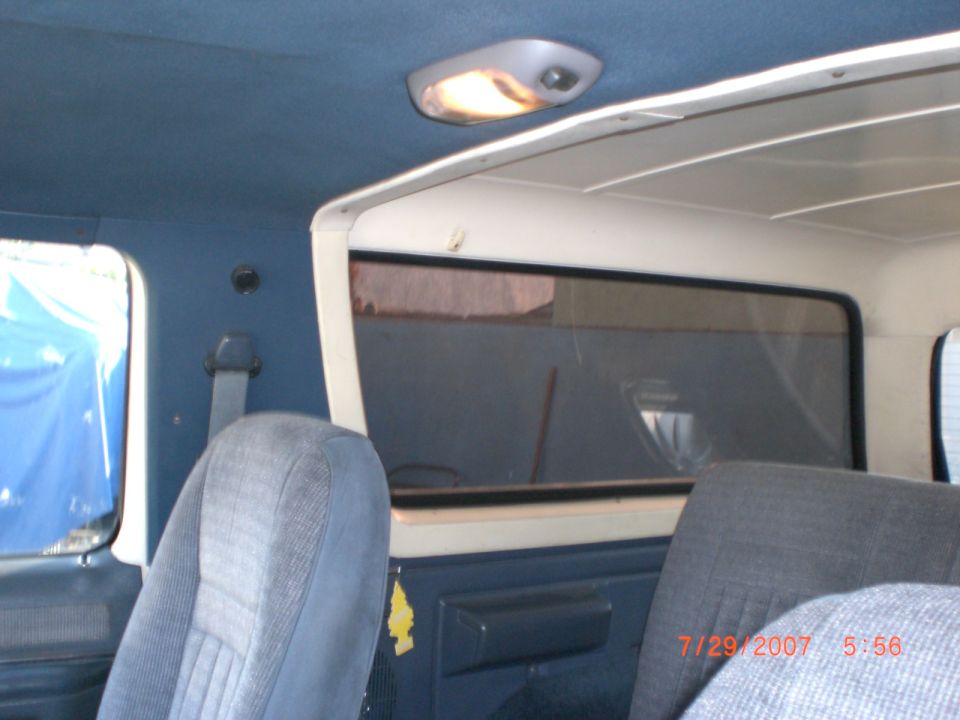 Interior view of a 1991 Ford Bronco showing seats, headliner, and rear window