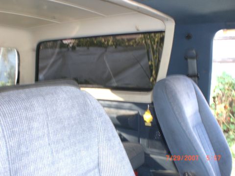 1991 Ford Bronco - Interior view of a 1991 Ford Bronco showing the rear seats and window.