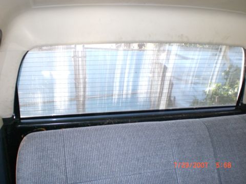 1991 Ford Bronco - Interior view of a vehicle's rear window and seat, with a timestamp visible.