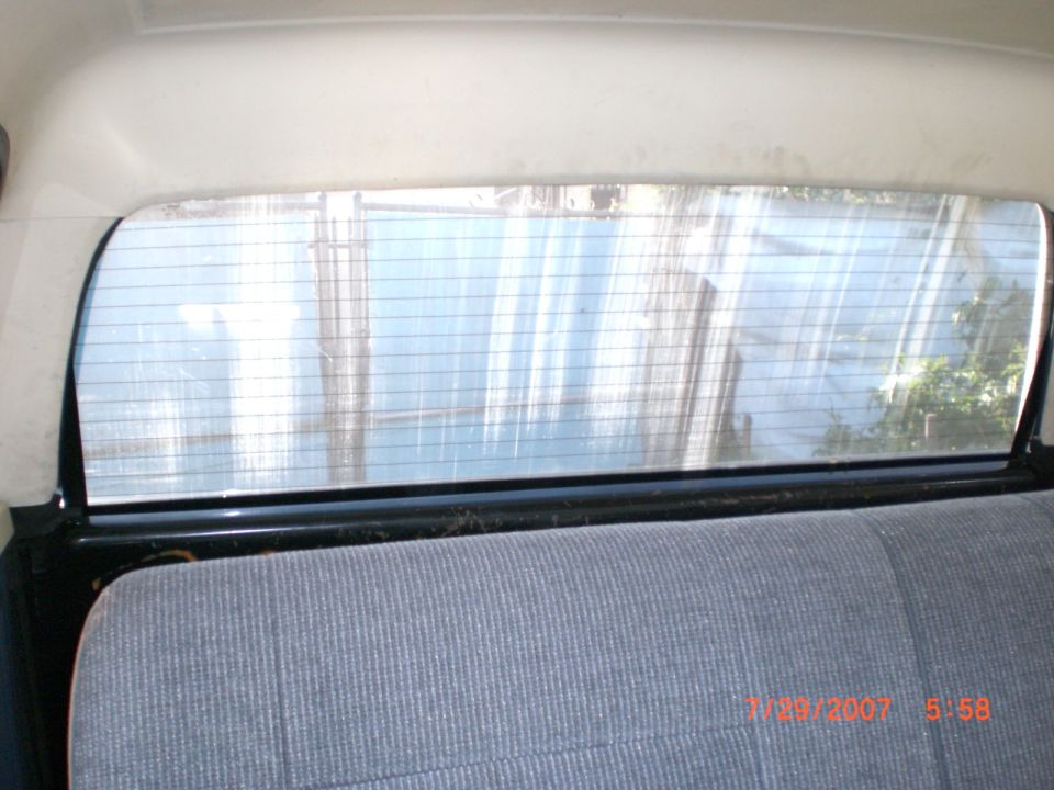 Rear window and seat of a vehicle
