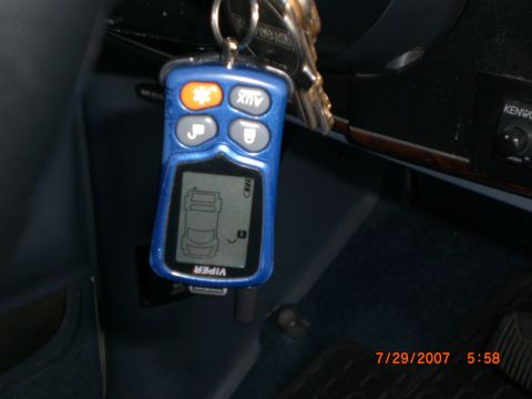 1991 Ford Bronco - Car alarm remote and keys hanging from the ignition.