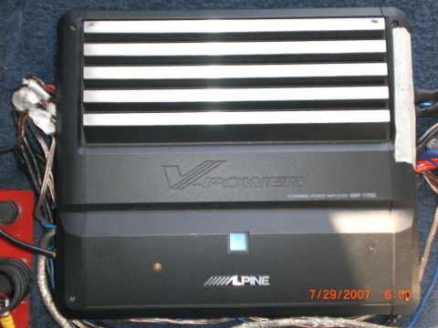 1991 Ford Bronco - An Alpine V-Power amplifier is shown with its connected wiring, indicating it's a car audio component.