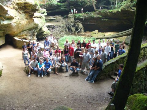 1991 Ford Probe - A group of people pose for a photo in a scenic, natural environment with rock formations and trees.