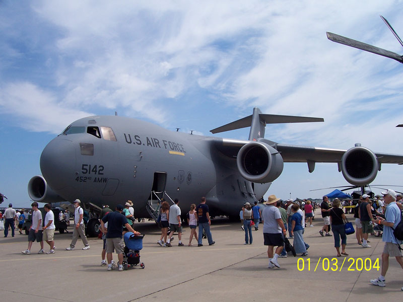 US Air Force C-17 Globemaster III cargo plane on tarmac with people around