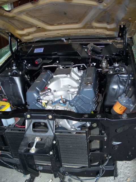1971 Ford Ranchero - Engine bay with a V8 engine installed, custom valve covers and intake.