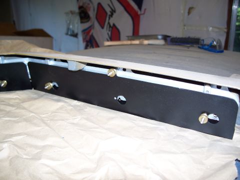 1971 Ford Ranchero - A car part, possibly a bracket, is shown on a surface covered with paper.