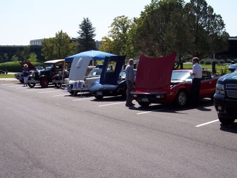 1972 Ford Ranchero - Cars are displayed with their hoods open at a car show event.