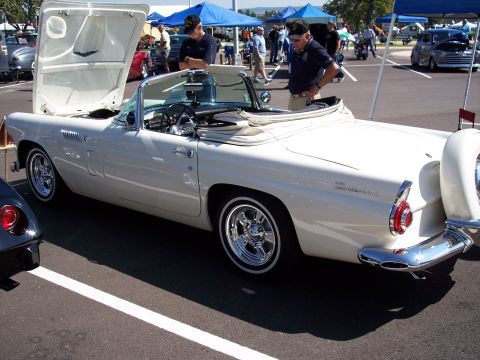 1972 Ford Ranchero - A white 1957 Ford Thunderbird convertible is displayed with its hood open, showing off its classic design.