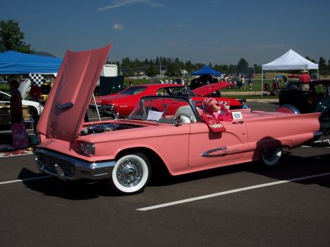 1972 Ford Ranchero - A pink 1959 Ford Thunderbird convertible is displayed with its hood open, Pink Panther toys in the driver's seat.