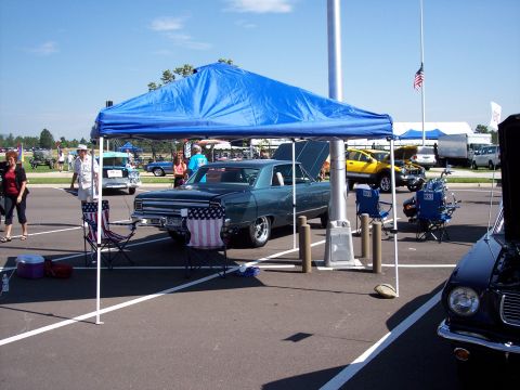 1972 Ford Ranchero - A classic 1966 Chevrolet Chevelle is displayed at an outdoor event, with a blue tent providing shade.