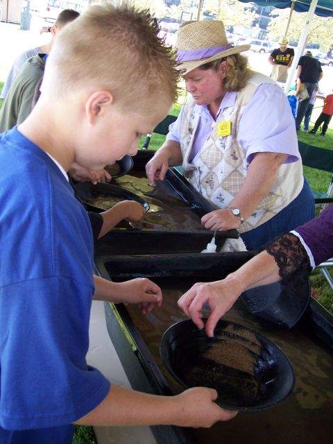 1972 Ford Ranchero - People are trying their luck panning for gold at an outdoor event.