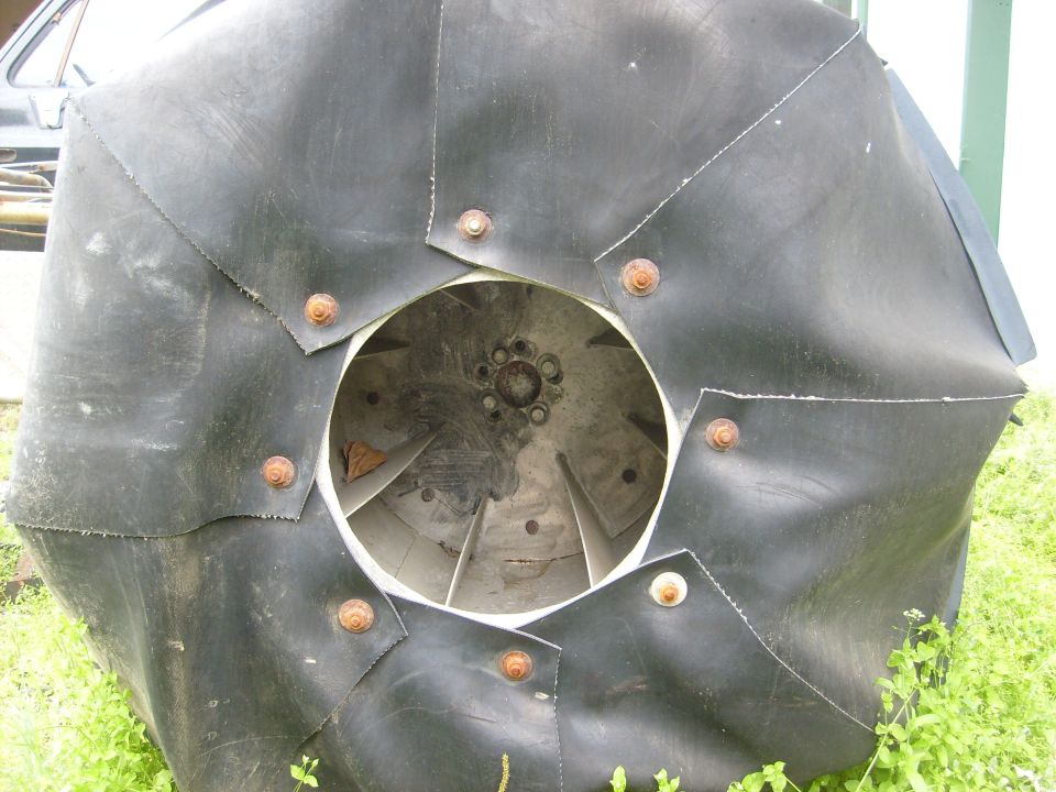 Custom tire tread with metal fasteners and visible fan blades inside