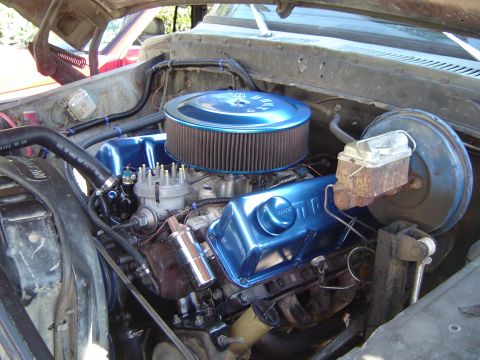 1978 Ford Bronco - Close-up of a vehicle's engine bay, custom blue valve covers and an aftermarket air cleaner.