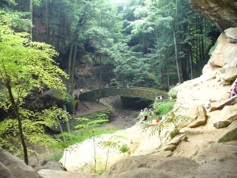 1991 Ford Probe - A scenic view of a stone bridge and surrounding forest, with visitors exploring the area.