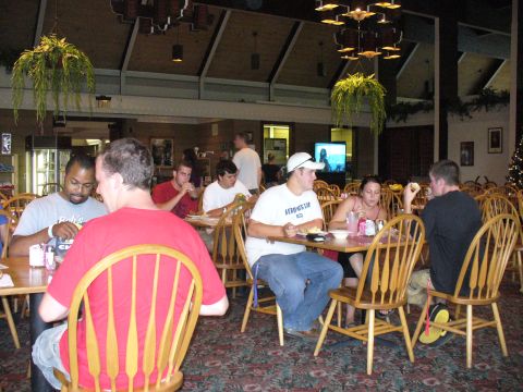 1991 Ford Probe - Diners are seated at tables in a restaurant, with some eating meals.