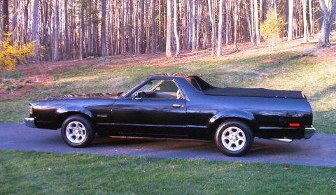 1990 Ford F-250 - Side view of a black coupe utility vehicle parked outdoors.
