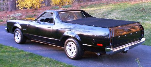 1990 Ford F-250 - This 1972 Ford Ranchero is a classic pickup truck with a black exterior and bed cover.