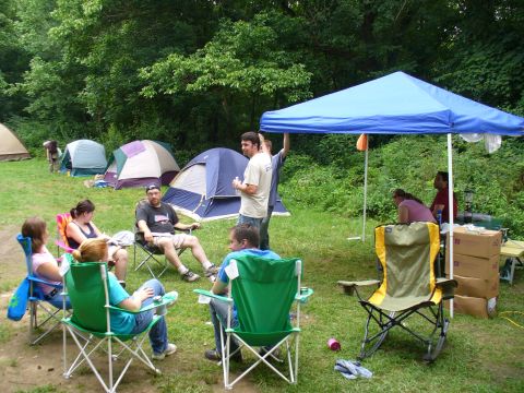 1991 Ford Probe - A group enjoys a camping trip with tents set up in a wooded area.
