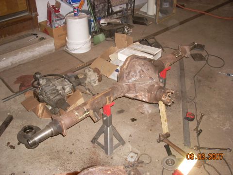 2000 Chevrolet Tahoe - This photo shows a vehicle's rear axle assembly and a transfer case, likely for repair or modification.