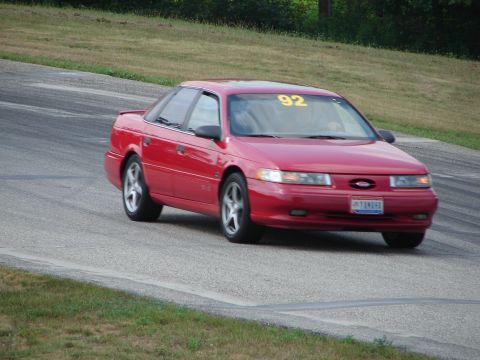 1993 Ford Taurus - 1993 Ford Taurus seen on a race track with the number 92 displayed.