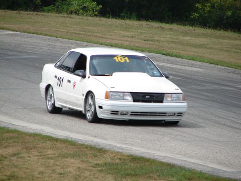 1993 Ford Taurus - White 1993 Ford Taurus racing on a track, displaying the number 101.