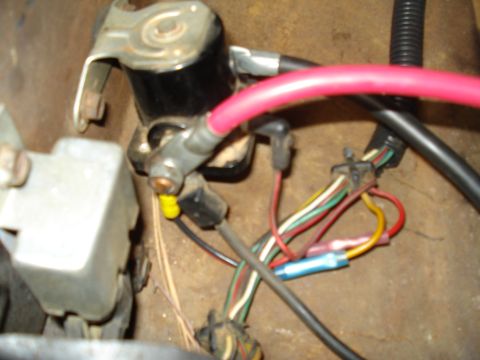 1967 Ford F-250 - Close-up view of a vehicle's electrical wiring harness, showing various colored wires and connections.