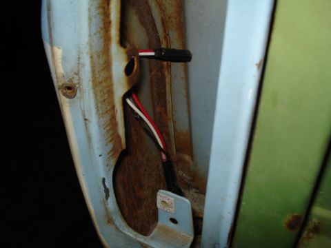 1967 Ford F-250 - Wiring harness with connector visible in a rusty door jamb area.