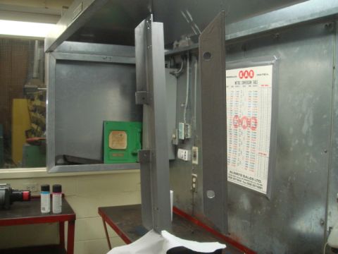 1996 Ford Bronco - Metal parts are shown in a workshop setting, with a metric conversion table visible on the wall.
