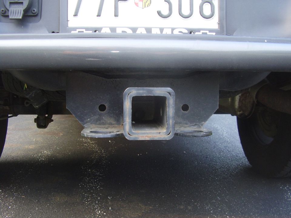 Rear bumper with trailer hitch receiver and license plate