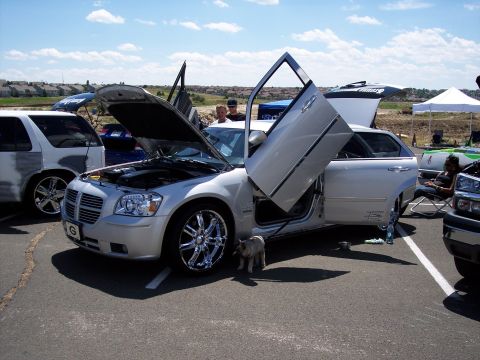 1972 Ford Ranchero - Modified Dodge Magnum with custom doors displayed at an outdoor event.