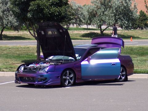 1972 Ford Ranchero - Customized coupe with hood and trunk open, parked outdoors.