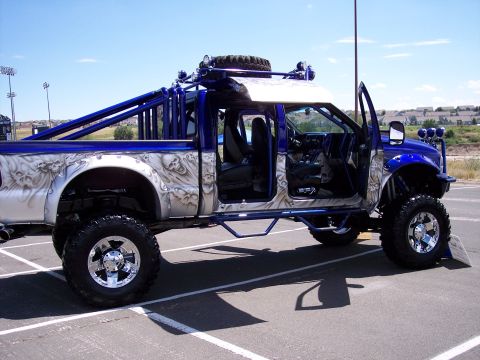 1972 Ford Ranchero - This heavily modified pickup truck features custom airbrushed skull graphics and an extensive roll cage.