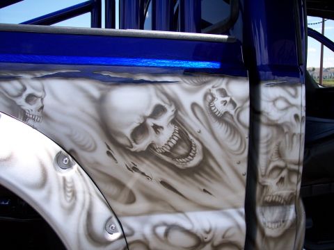 1972 Ford Ranchero - Custom airbrushed truck door features detailed skull graphics with flames and blue paint accents.