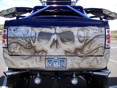 1972 Ford Ranchero - This pickup truck features elaborate skull airbrushing on its tailgate and custom blue accents.
