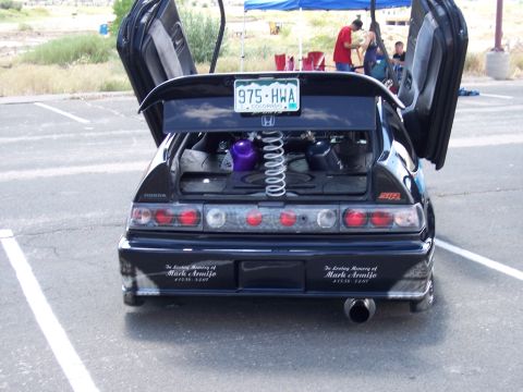 1972 Ford Ranchero - Modified Honda CRX with butterfly doors open and custom rear spoiler. Memorial decals are visible on the bumper.