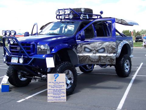 1972 Ford Ranchero - Customized 1999 Ford F-250 Super Duty pickup truck with skull graphics and extensive modifications.
