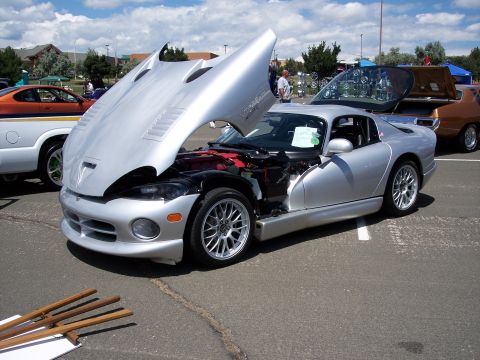 1972 Ford Ranchero - Silver Dodge Viper on display with its hood and trunk open, revealing the engine and interior.