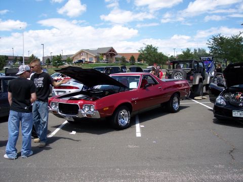 1972 Ford Ranchero - Red 1970s Ford Ranchero pickup truck at an outdoor car show event.