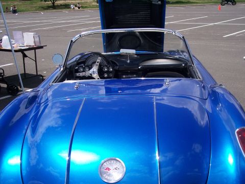1972 Ford Ranchero - Rear view of a blue 1957 Chevrolet Corvette convertible with hood open, showing the interior and dashboard.
