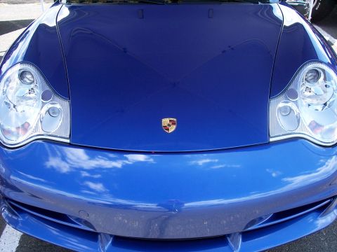 1972 Ford Ranchero - Front view of a blue Porsche 911, showing the hood, headlights, and emblem.