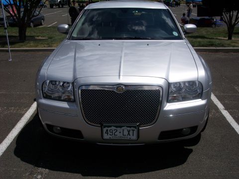 1972 Ford Ranchero - This silver Chrysler 300 is parked facing forward, displaying its distinctive grille and front end.