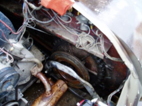 2000 Ford E350 - A messy engine bay with various components and wiring visible.