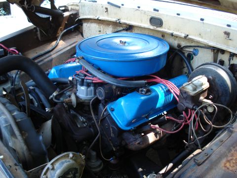 1967 Ford F-250 - Close-up of a 1967 Ford F-250 engine, showing the V8 configuration and blue painted components.