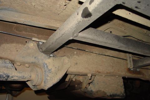 1993 Ford Bronco - Close-up view of the underbody frame and suspension components, showing rust and wear. The Supermotors.net watermark is visible.