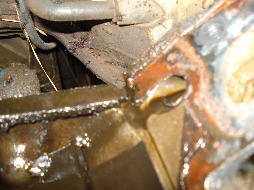 Close-up of oily engine component