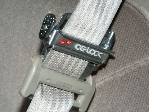 2001 Mercury Grand Marquis - Close-up of a CG-Lock seatbelt adjuster device with ON and OFF labels visible.
