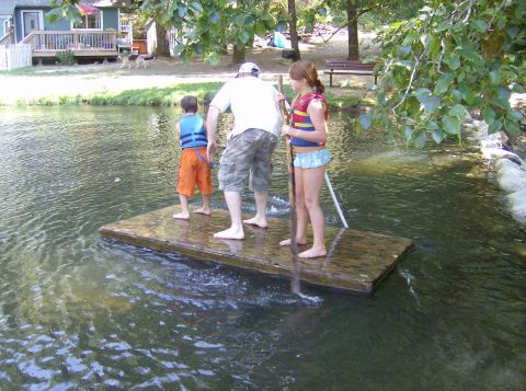 1986 Ford Bronco - A family enjoys a day on the water aboard a makeshift raft.