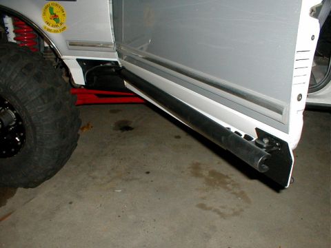 1996 Ford Bronco - This 1996 Ford Bronco features large off-road tires and custom side sliders, indicating modifications for terrain.